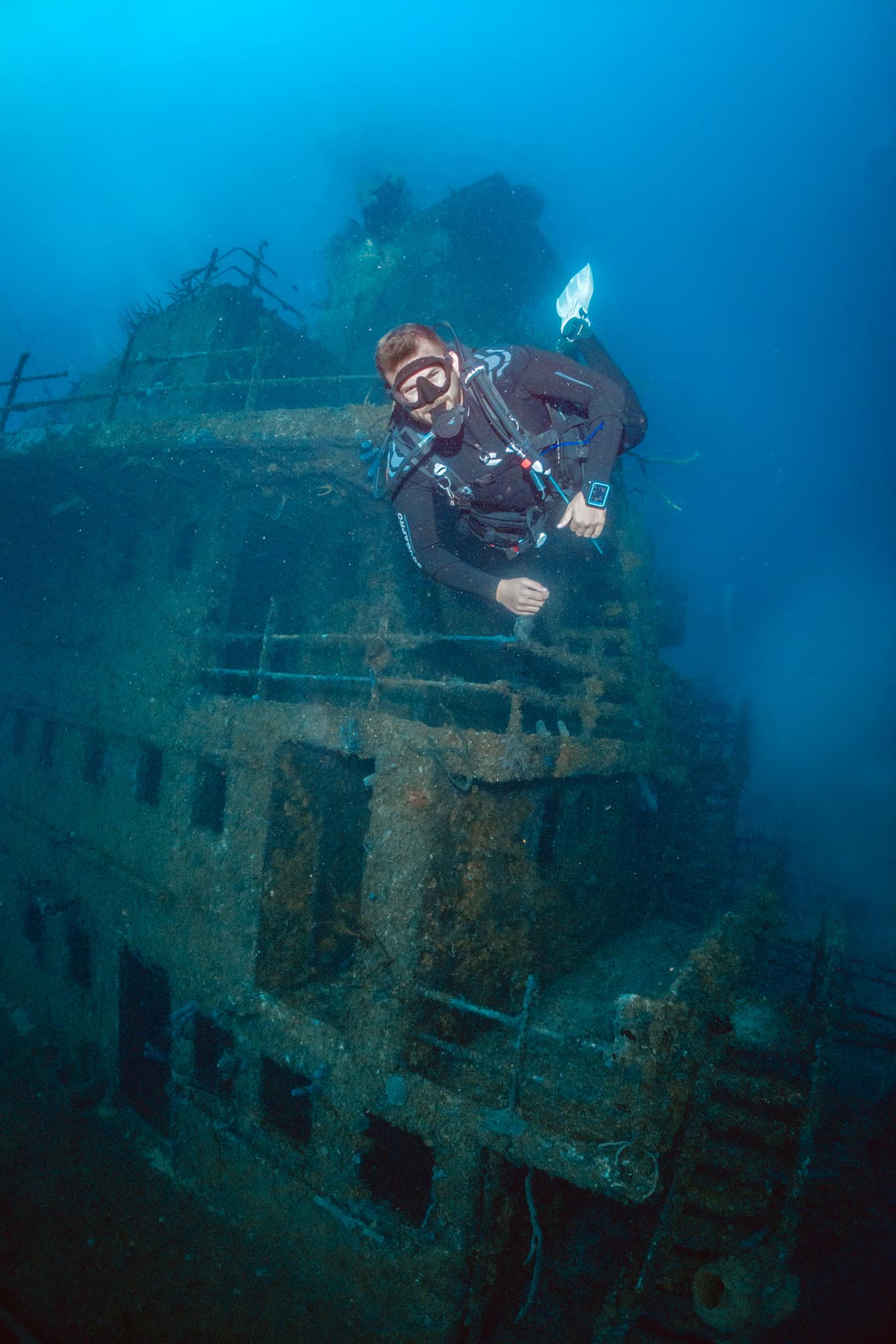 A diver explores a wreck during the Wreck Diver speciatly PADI course in roatan.