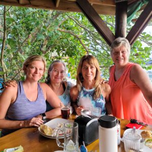 Four women are having dinner at the restaurant Sun Downers in Roatan, Honduras.