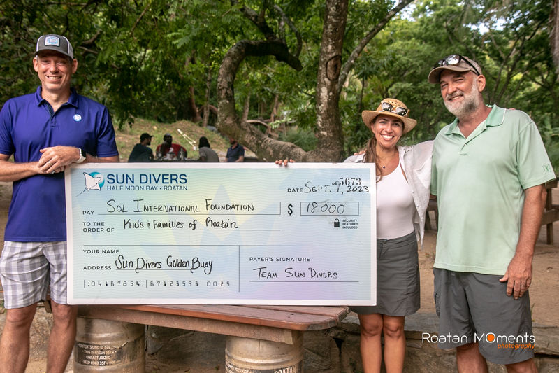 Big check presentation of 18,000 to the SOL Foundation of Roatan.